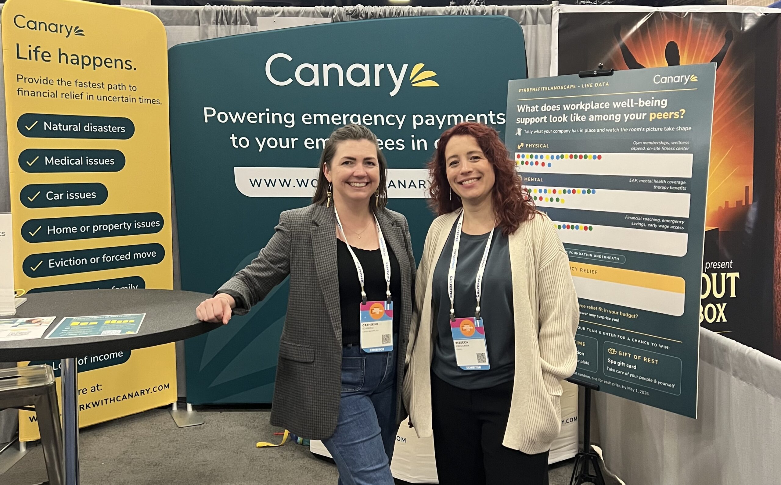 Canary team members at the WorldatWork Total Rewards conference talking to benefits leaders about emergency financial relief for employees